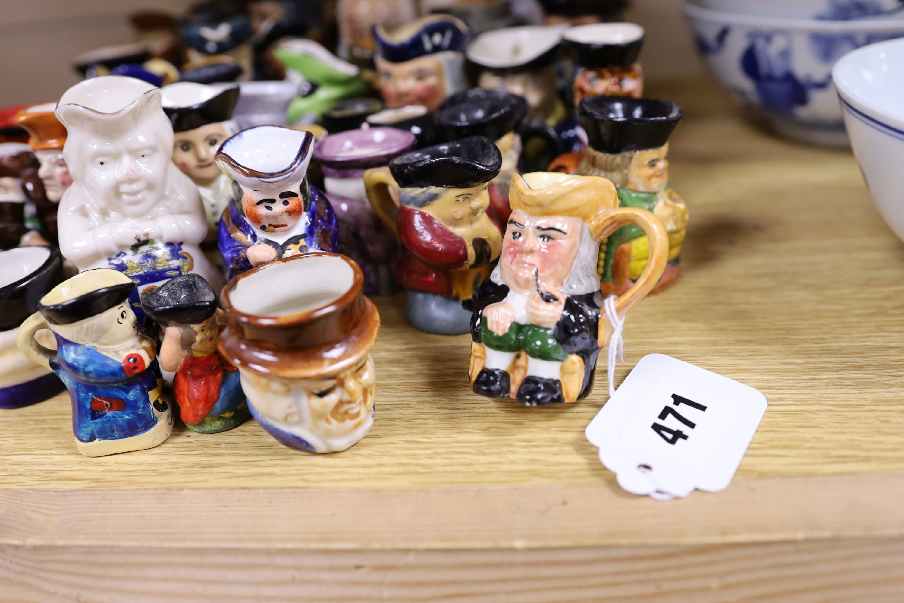 Fifty two miniature Toby jugs